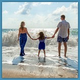 a family walking on the beach building memories