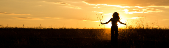 grateful girl at sunset